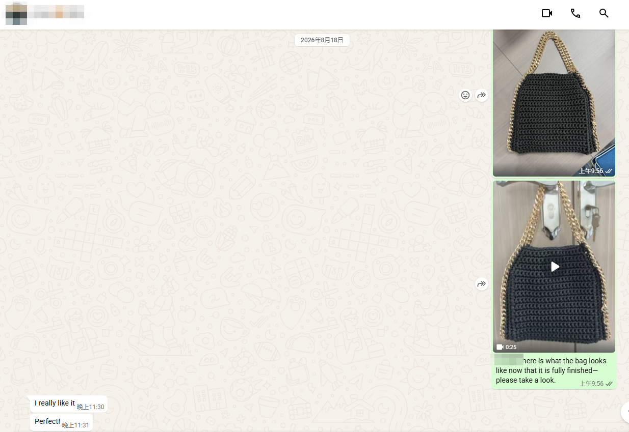 Buyer approving a finished black crochet chain bag sample
